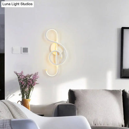 Modern white led wall lamp shaped like a musical treble clef with warm glow featuring music note design wall light