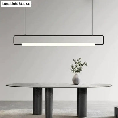 Minimalist black metal pendant light with rectangular frame and glowing white led strip for nordic minimalist bar hanging