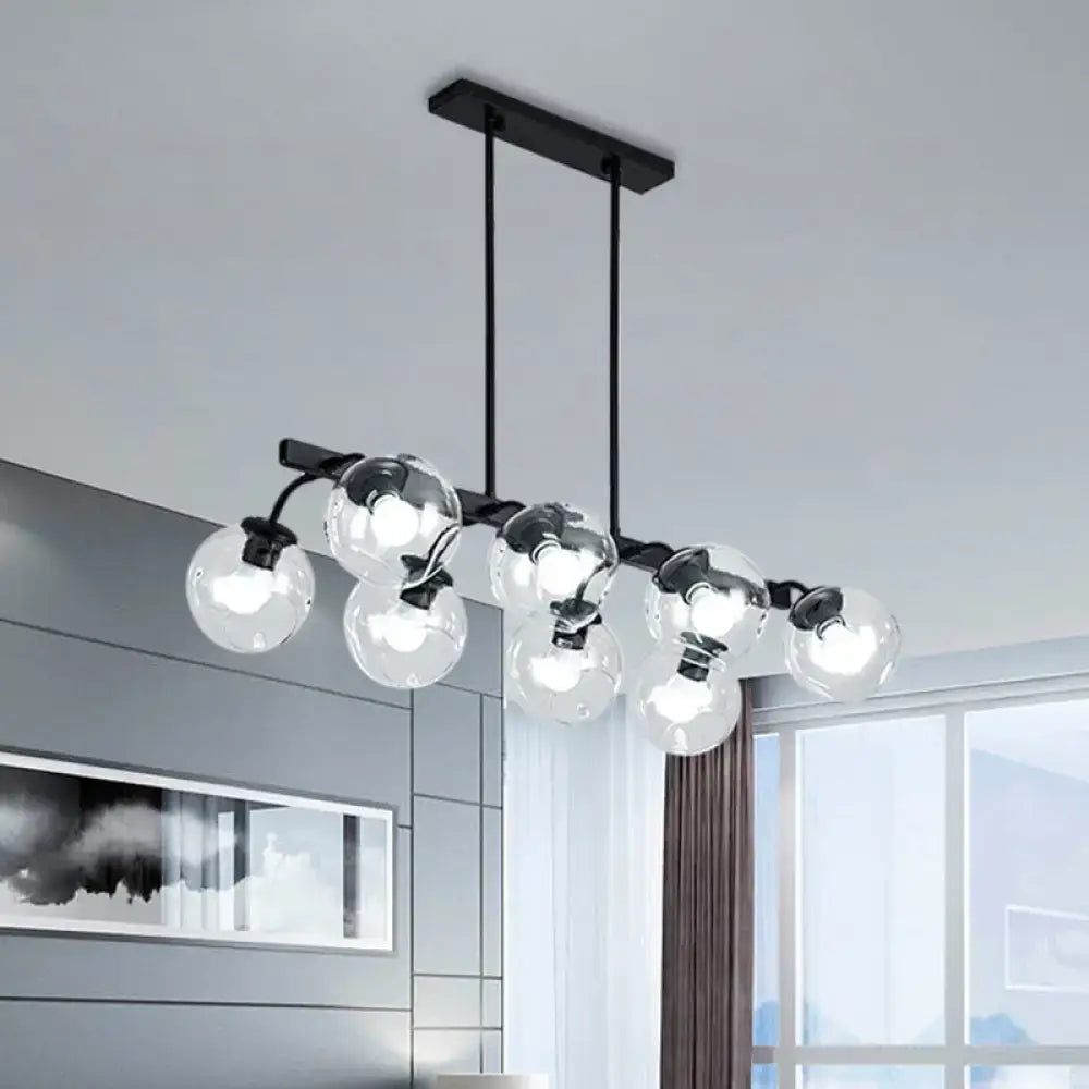 Modern black metal chandelier with clear glass globe bulbs featuring orb shade for kitchen and dining room use