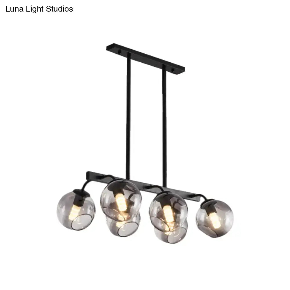 Black metal chandelier with four smoked glass globe orb shades for modern kitchen and dining room lighting