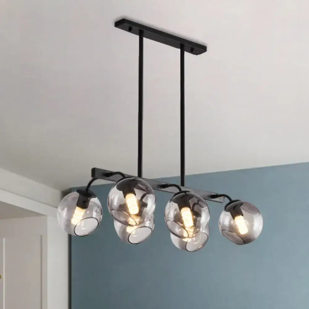 Modern black metal chandelier with four spherical smoked glass orb shade globes for kitchen and dining room lighting