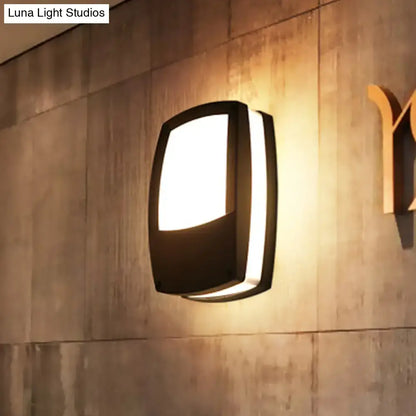 Modern black outdoor led wall lamp with sleek rectangular design mounted light fixture providing warm ambient lighting