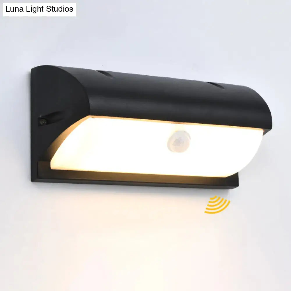 Modern black outdoor led wall lamp with sleek curved design and warm white illumination motion-sensor wall lamp