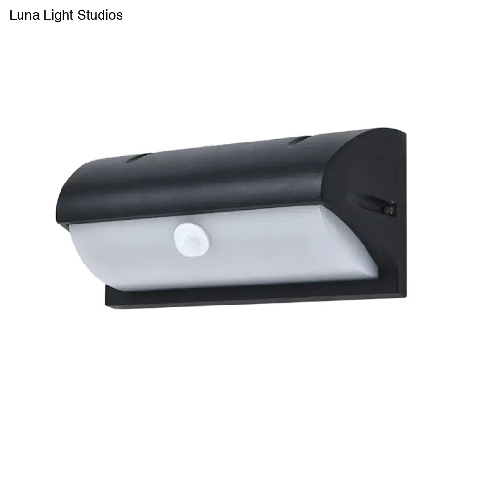 Modern black outdoor led wall lamp with solar-powered motion sensor and frosted white diffuser panel