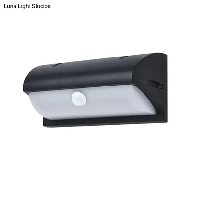 Modern black outdoor led wall lamp with solar-powered motion sensor and frosted white diffuser panel