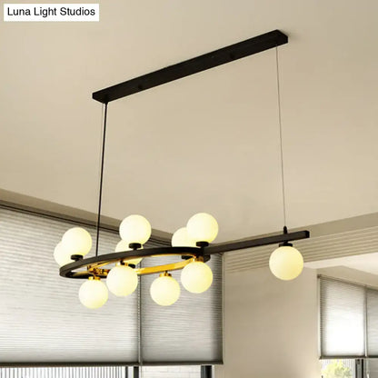 Modern black oval hanging light fixture chandelier featuring gold accents and frosted glass globe bulbs for dining room