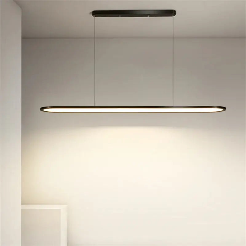 Modern black minimalist decorbites led pendant lights with sleek rectangular design and thin hanging cords for indoor lighting