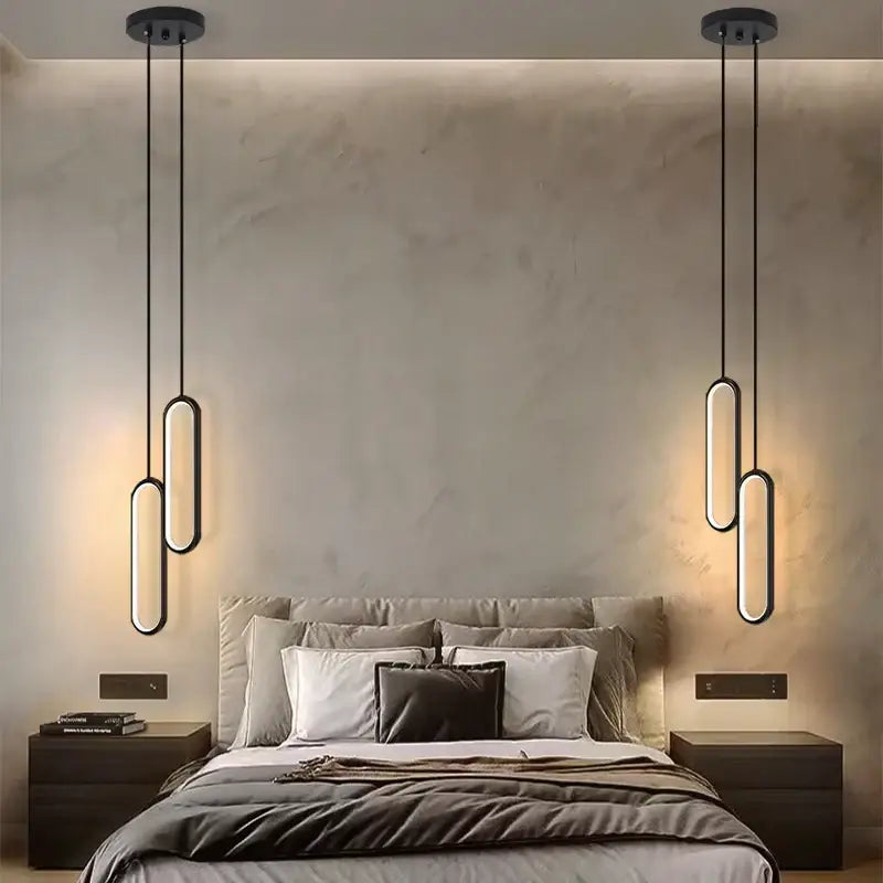Modern black oval pendant light with black finish and led bulbs featuring sleek elongated design for dining room use