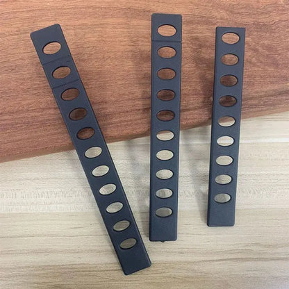 Modern black patterned knife blade protectors made of plastic with oval cutouts for decorbites knife blade storage