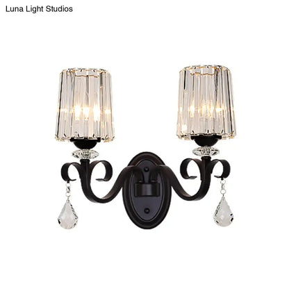 Elegant black wrought iron wall mount lamp with two crystal-framed glass shades and dangling teardrop crystals