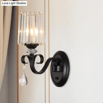 Modern black wrought iron wall mount lamp with faceted prismatic crystal shade and dangling teardrop crystals for living room