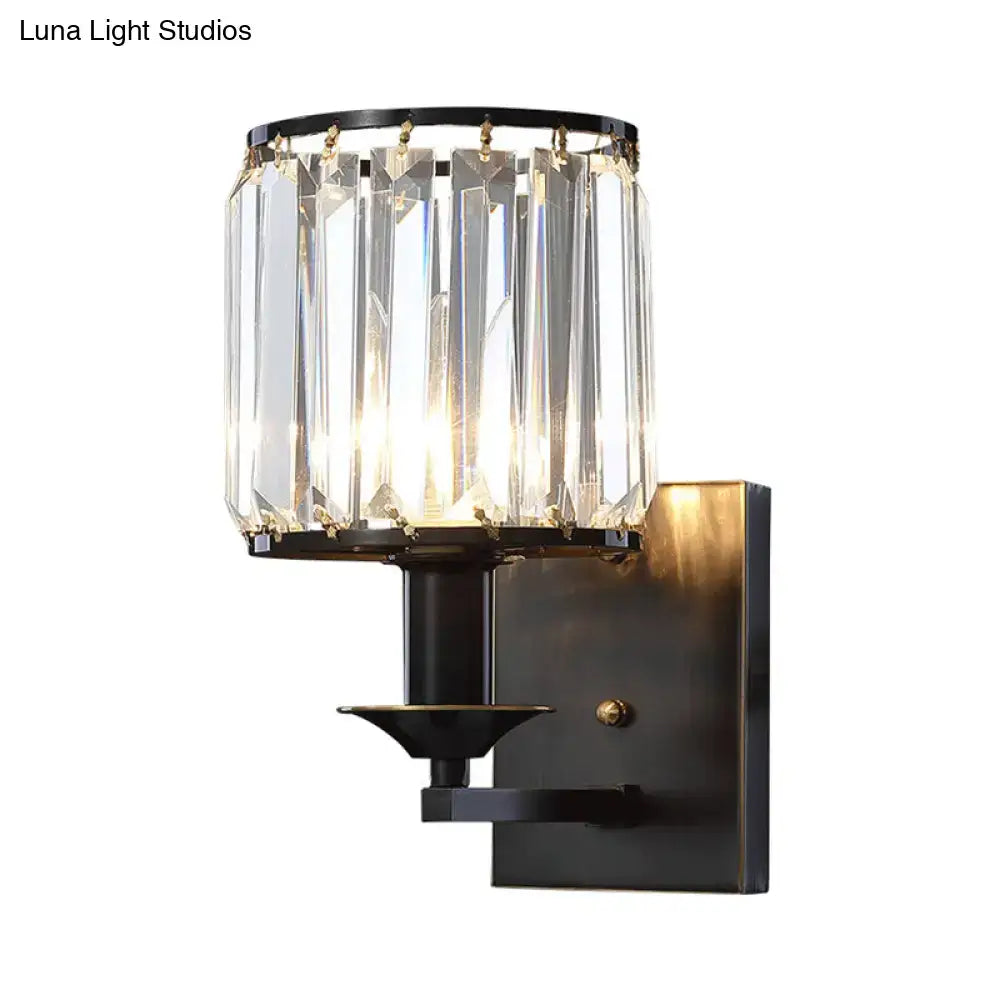Elegant modern black metal wall sconce with prismatic crystal chandelier and gold-toned accents compatible with e12 light type