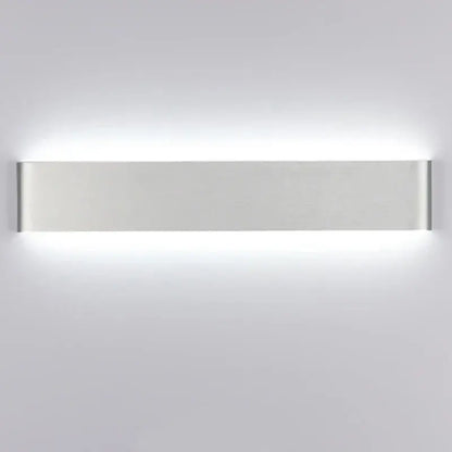 Modern silver rectangular led wall lamp with sleek minimalist design providing warm glow for bedroom lighting