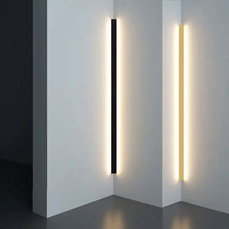 Modern black rectangular led wall lamp with sleek gold linear design emitting warm ambient light for living room