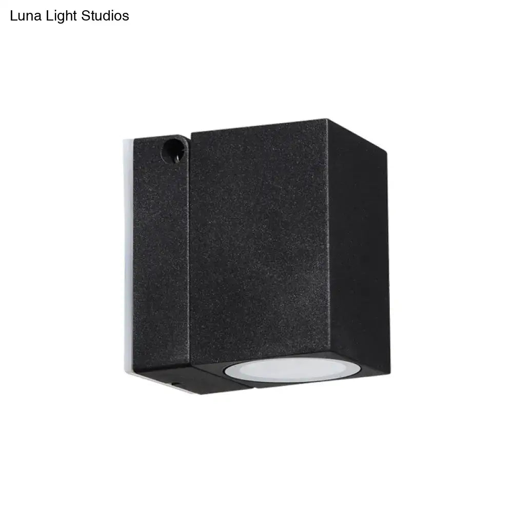 Modern black rectangular mini textured wall sconce with circular white LED lens for outdoor maximum bulb wattage use