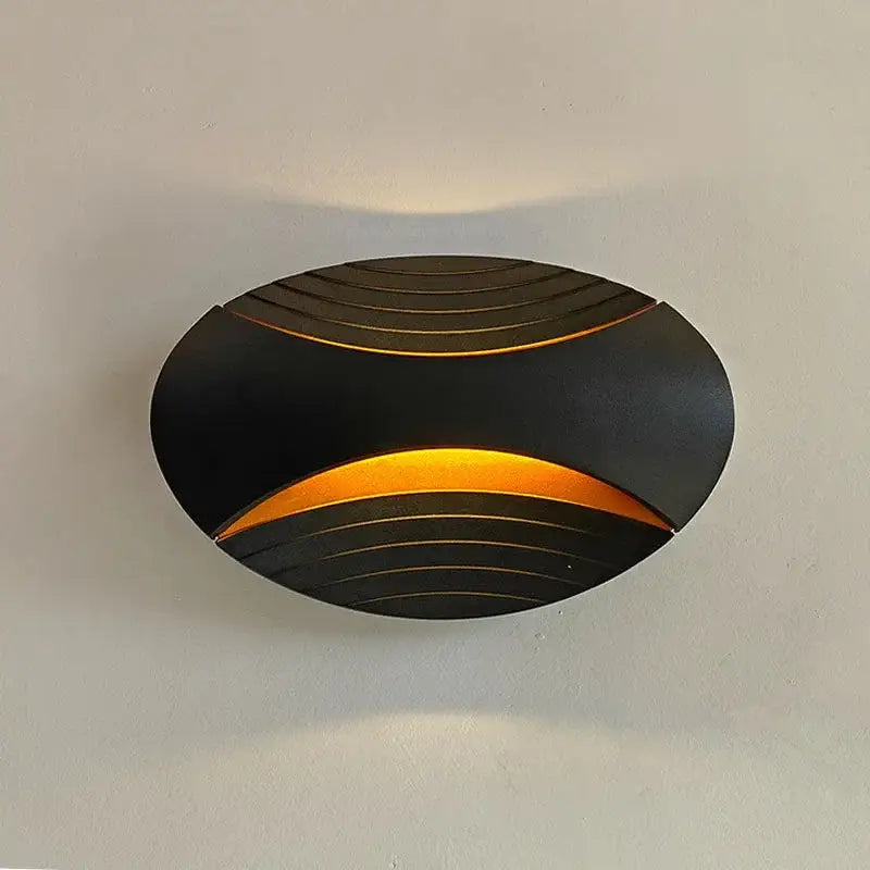 Modern black ribbed led wall lamp with curved design and warm amber light for corridor lighting