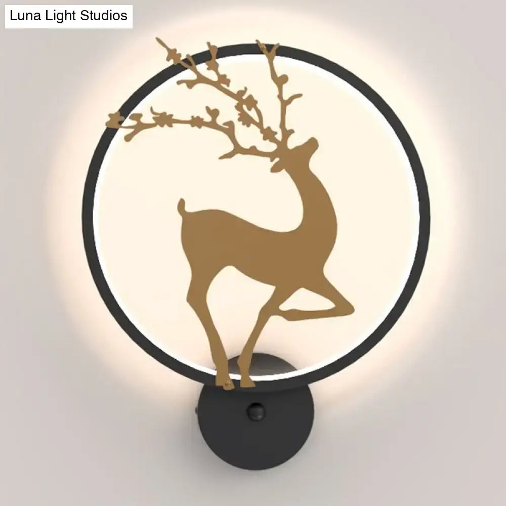A modern black ring led elk mural wall sconce with golden deer silhouette and softly glowing backlight for bedrooms