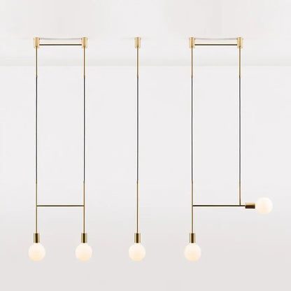 Modern black rose gold pendant light with minimalist brass frame and frosted glass globe bulbs for dining room decorbites black rose