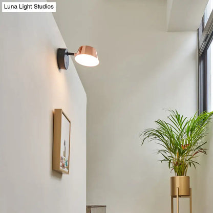 Modern black and rose gold copper-finished sconce light with sleek design and direct wired installation maximum bulb wattage