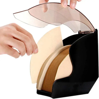 Modern black and rose gold wave coffee filter dispenser with black plastic organizer holding beige and brown coffee filters