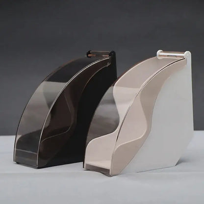 Two sleek modern coffee filter dispensers in dark brown and beige with curved glossy surfaces and minimalist design
