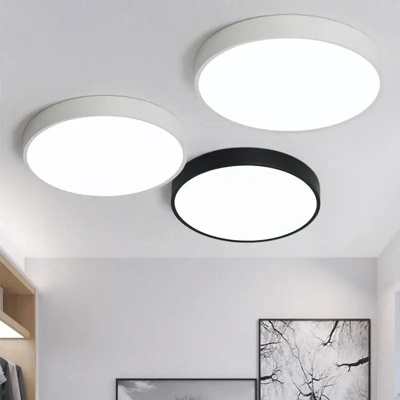 Three modern circular ceiling lights in white and black with sleek minimalist design dimmable led decorbites ceiling light