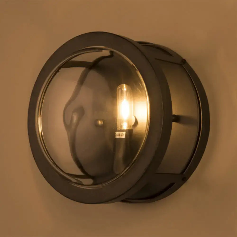 Modern black metal wall sconce with clear glass lens and exposed e12 e14 bulb base for hallway lighting