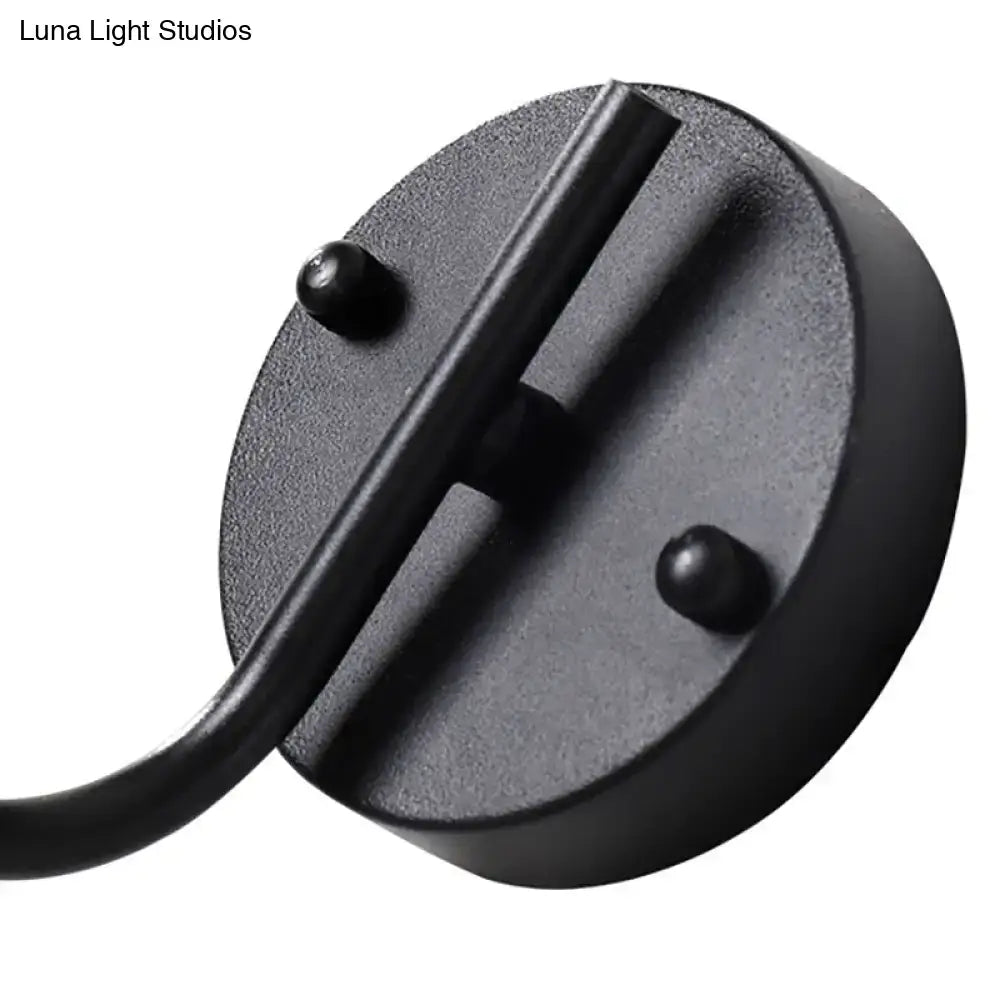 Black matte-finished metal ceiling mount for modern black sconce light with global milk glass shade in living room
