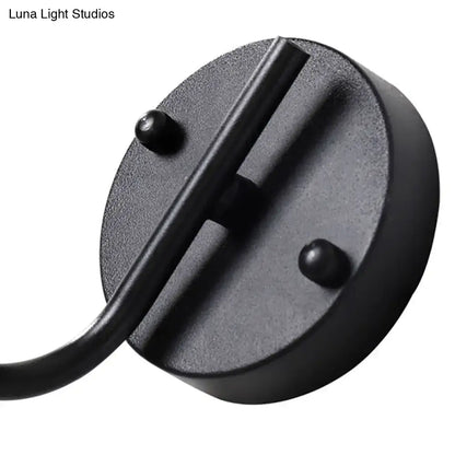Black matte-finished metal ceiling mount for modern black sconce light with global milk glass shade in living room