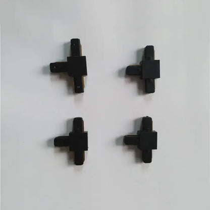 Black plastic cross-shaped connector set for decorbites ceiling track rail in modern black and silver kitchen light design