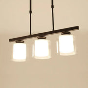 Modern black metal pendant light with three clear glass cylindrical shades ideal for cooking space with e26 e27 bulbs