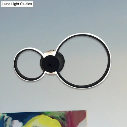 Modern black and silver led hoop wall lamp with sleek minimalist circular ceiling light design for bedroom use