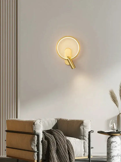 Modern black and silver led wall lamp featuring a gold-toned brass copper led circular sconce with warm ambient lighting