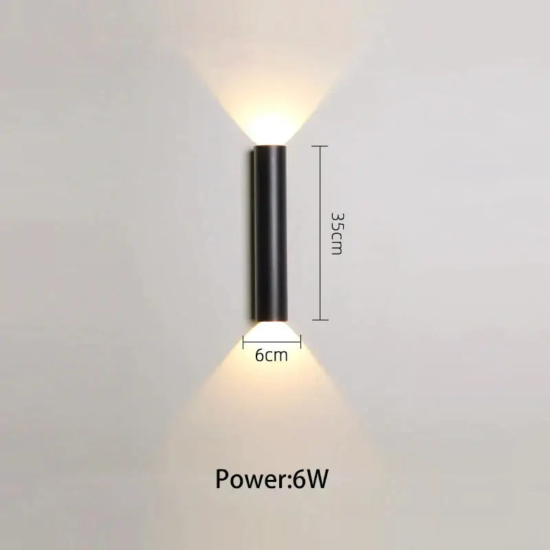 Modern black and silver led wall lamp featuring dual downward-facing light sources in a cylindrical design