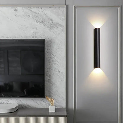 Modern black and silver led wall lamp with warm focused lighting ideal as a bedroom or tv background wall lamp