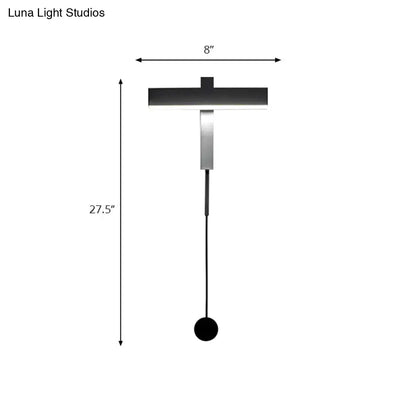 Modern black and silver wall lamp with adjustable arm featuring a sleek black shade and polished metallic bulb base