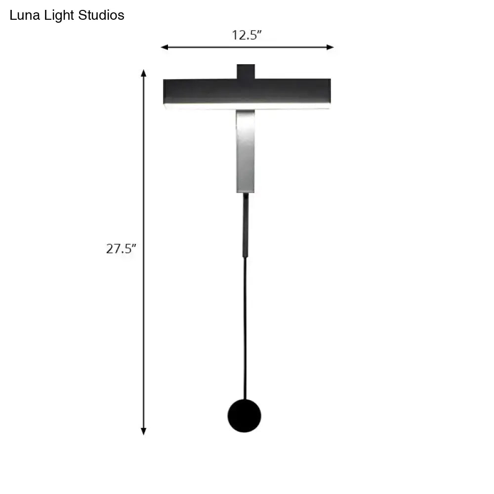 Modern black and silver led wall lamp with adjustable arm, sleek horizontal bar, vertical stem, and bulb base for bedroom use