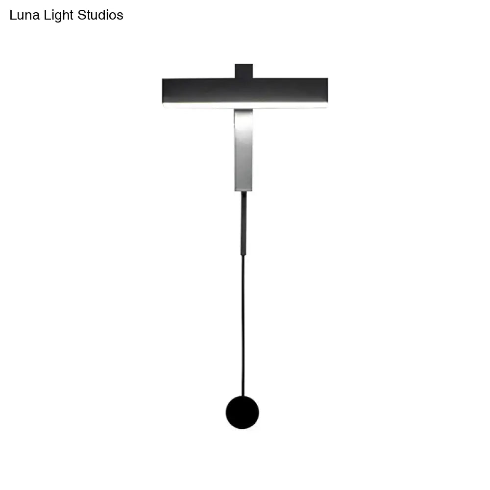Modern black and silver led wall lamp with adjustable arm featuring a minimalist pendant light and bulb base design
