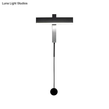 Modern black and silver led wall lamp with adjustable arm featuring a minimalist pendant light and bulb base design