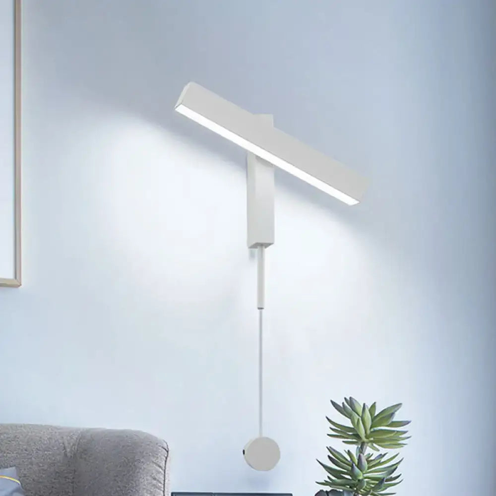 Modern white led wall lamp with adjustable arm and sleek minimalist design featuring a sturdy bulb base for bedroom use