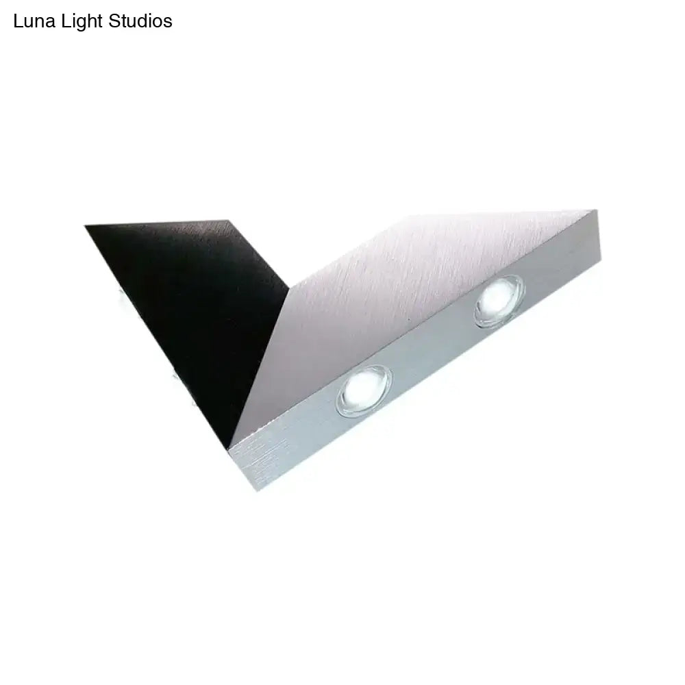 Modern black and silver metal sconce led wall light with angular design and two circular bulbs for bedroom decor