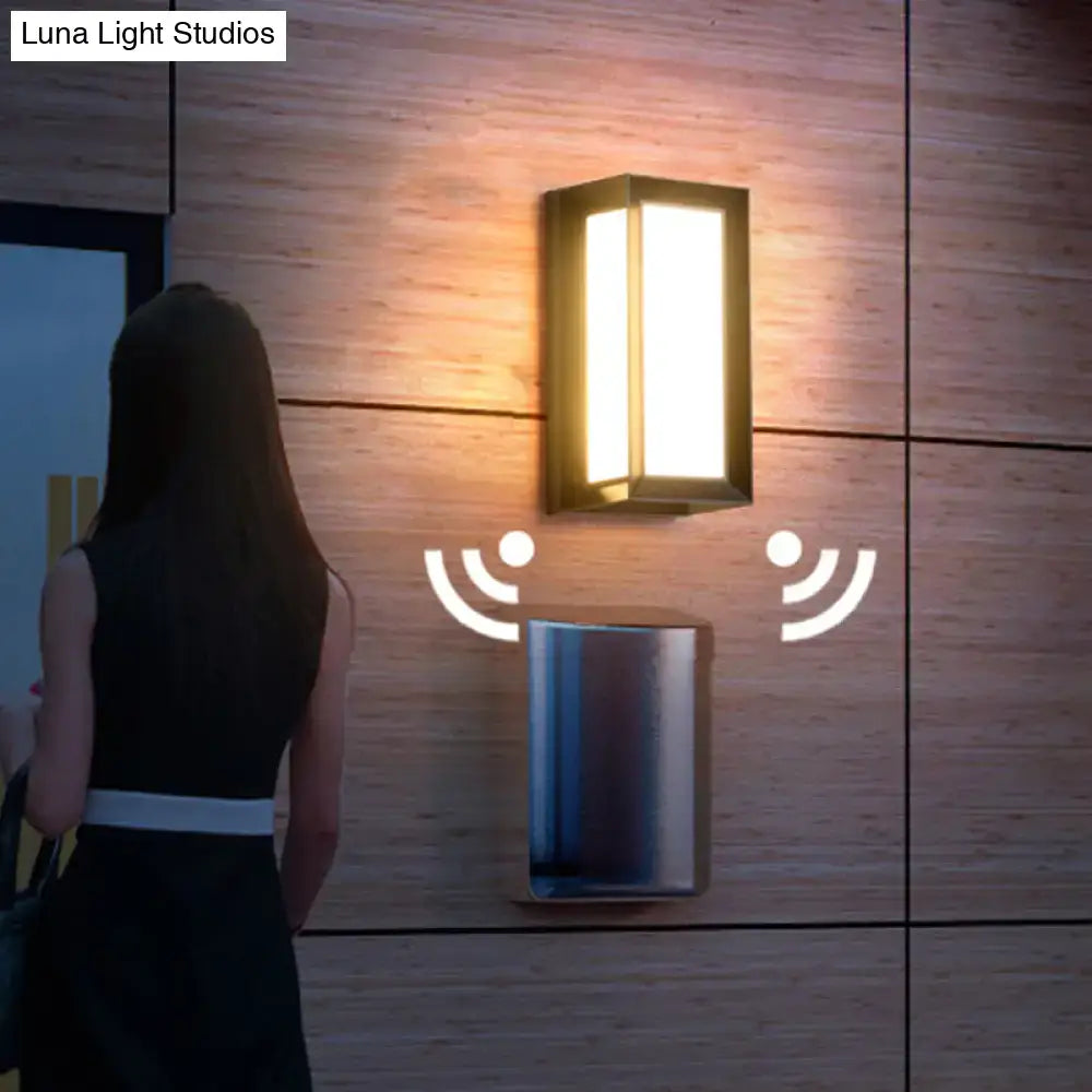 Modern black sound activated wall sconce with sleek rectangular frame and warm white led light for 220v-240v use