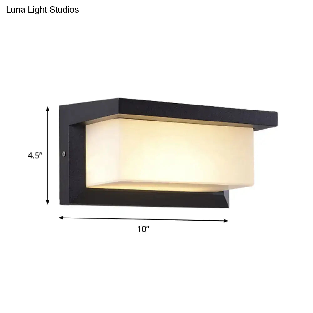 Modern black sound activated wall sconce with frosted glass panel emitting warm light for 220v-240v use
