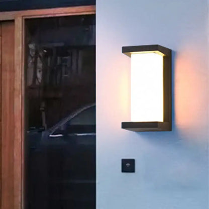 Modern black sound activated wall sconce with frosted glass panel emitting warm white light 220v-240v for bedroom use