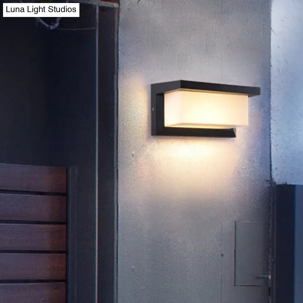 Modern black sound activated wall sconce with rectangular frosted glass panel emitting warm light 220v-240v