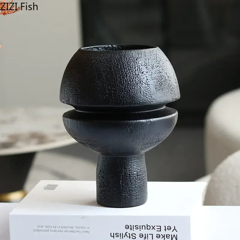 Modern black spherical resin sculpture with a textured ceramic vase design for living room decorbites black spherical art ornament