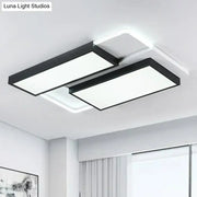 Modern black DecorBites™ LED flush ceiling light fixture with acrylic overlapping panels emitting bright white light