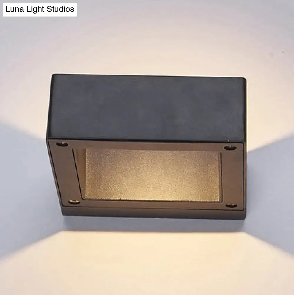 Modern black square sconce light fixture with a textured gold diffuser panel for porch lighting