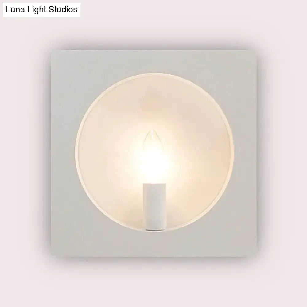 Modern black square wall sconce lamp with minimalist white circular frosted glass diffuser and exposed led bulb
