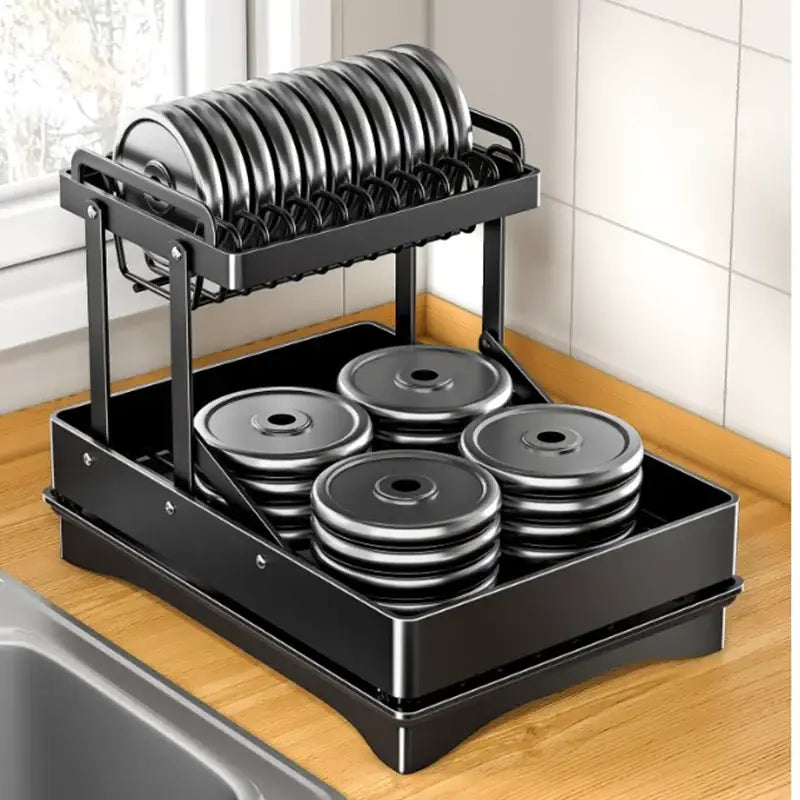 Modern black stainless steel two-tier dish drainer rack with curved wire shelves holding stacked plates for kitchen storage